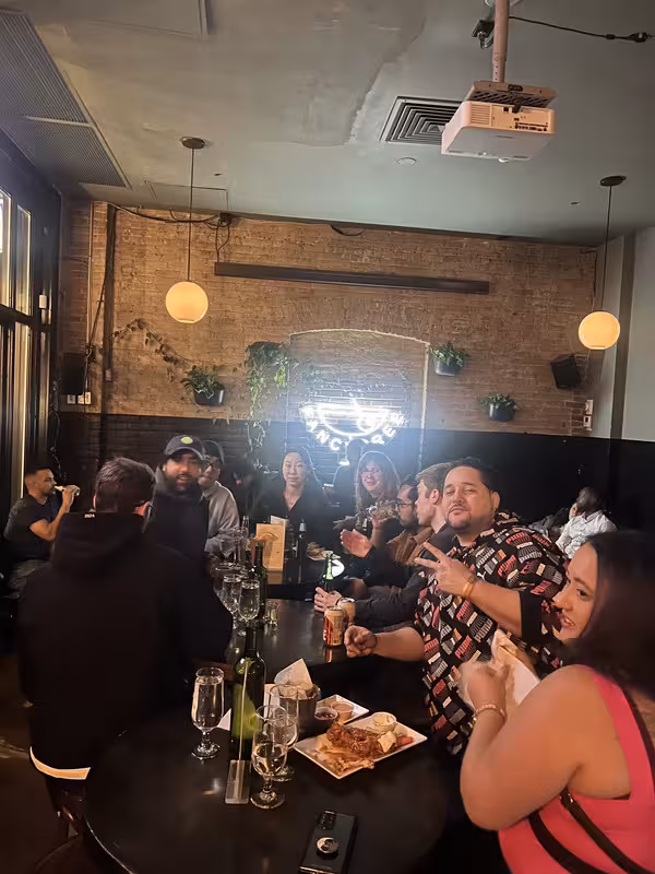 Lakers supporters gathered for a playoff hangout, smiling and engaging.